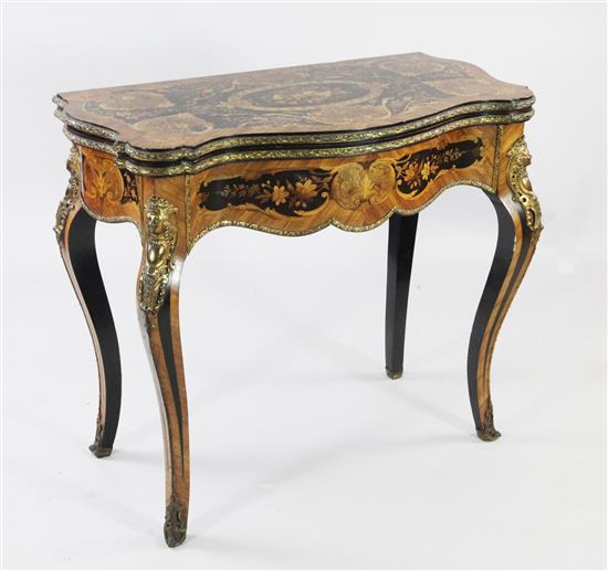 A Louis XV style marquetry inlaid and kingwood ormolu mounted folding card table, W.2ft 10.5in.